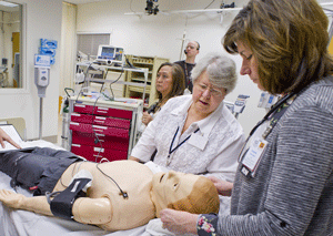 Participants practice procedures on a mannequin