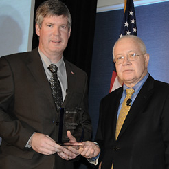 Dr. Robert A. Petzel (right), presents Timothy W. Liezert with the 2011 Clinical Simulation Training, Education and Research Executive Leadership Award